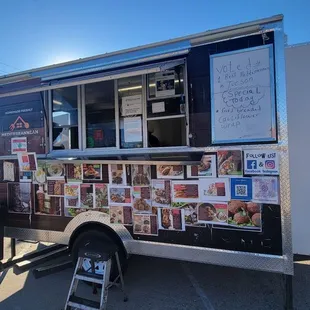 a food truck parked on the side of the road