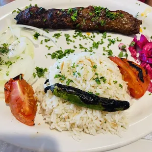 a plate of food with rice and vegetables