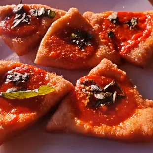 Montanare (fried pizza dough with tomato sauce)