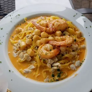 a plate of pasta and shrimp