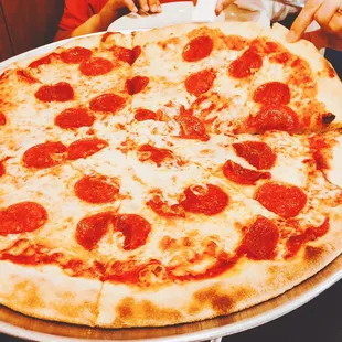 Large pepperoni dining in
