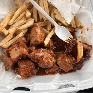 a closeup of a meal in a styrofoam container