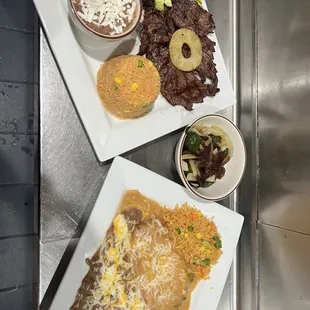 a plate of enchilada and a bowl of salsa