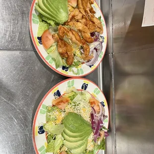 two plates of food on a counter