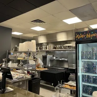 a woman at a counter in a restaurant