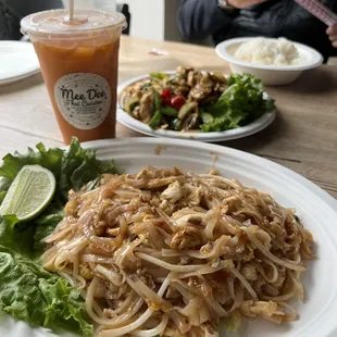 a plate of noodles and a drink