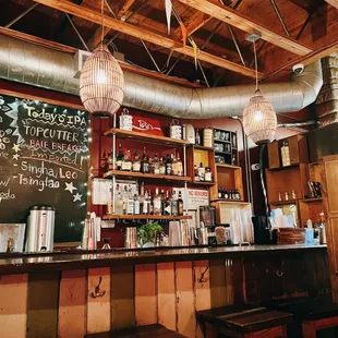 a bar with a chalkboard