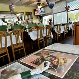 a restaurant with tables and chairs