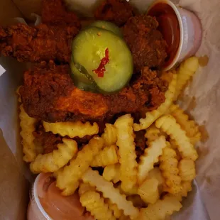 Spicy chicken tenders, fries, sauce, ketchup