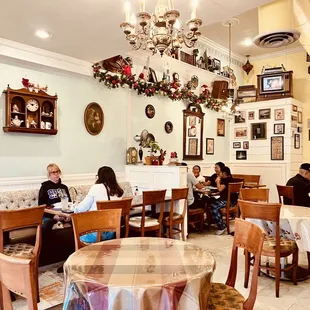 people sitting at tables in a restaurant