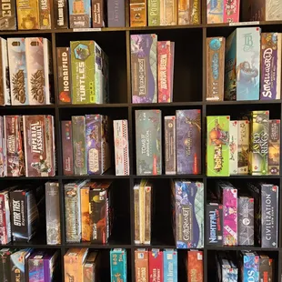 a bookcase full of board games