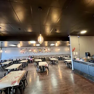 an empty restaurant with tables and chairs