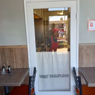 a restaurant entrance with a sign that says bless this food