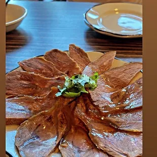 a plate of meat on a table