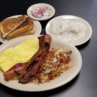 The "Big" Breakfast - 2 eggs scrambled, bacon, hashbrowns, sour dough toast, and a gravy biscuit.