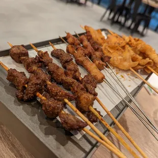 Beef skewers, charcoal grilled pork skewers, chicken skin