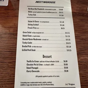 a menu on a wooden table