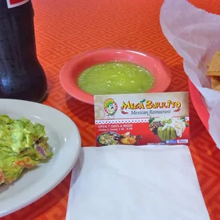Chips and Salsa included with meal, paid extra for Gauc. Coke in bottles means no free re-fills. Chips EXTREMELY HARD!