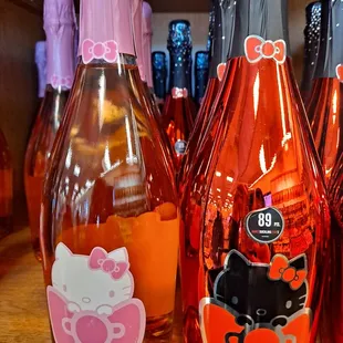 a variety of hello kitty wine bottles