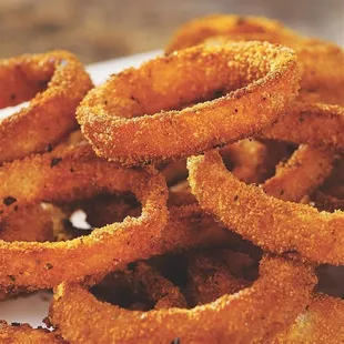 a pile of onion rings on a plate