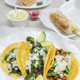 2 tacos asada (steak) and 1 taco pastor (pork), elote preparado (corn on the cob), side of rice, torta supreme