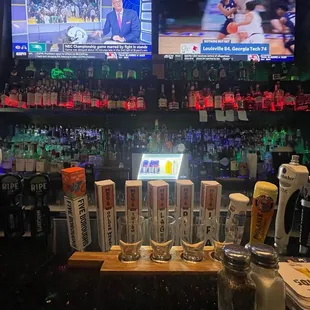 a bar with a variety of drinks