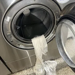 All 3 machines i used got jammed up and would't let me get my clothes out. This is the nasty water in the machine !