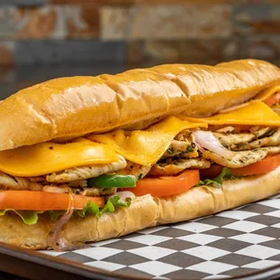 Chicken Powerlifter:
Chicken breasts marinated in garlic &amp; herbs, caramelized onions &amp; peppers, mayo, lettuce and smoked gouda cheese.