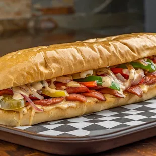 Hot Dog Shooter:
Sliced Hot Dog grilled with onions, peppers and signature dressing.