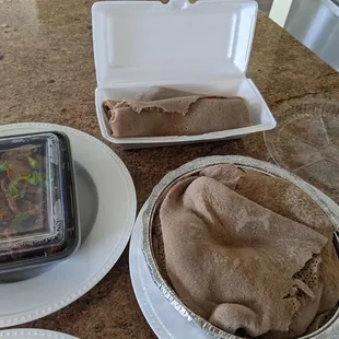 Got some take out!  Mogne Tibs, Veggie Combo, comes with side of injera