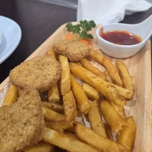 Kids chicken nuggets and fries. Daughter had already eaten half.