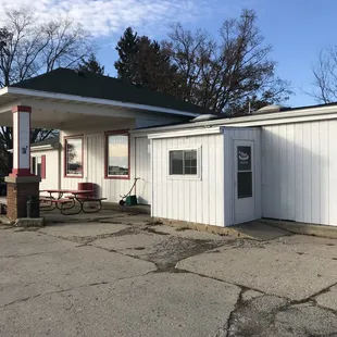 a white building with a red trim