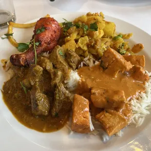 Tandoori chicken, potatoes, chicken tikka masala, and lamb curry.