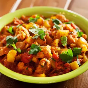 Aloo Gobi is a vegetarian dish made with potatoes, cauliflower, and Indian spices.