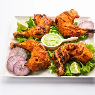 Grilled bone-in-chicken marinated in yogurt, garlic, ginger and fresh ground spices. Enjoy Tandoori Chicken at Mehfil Indian Cuisine.