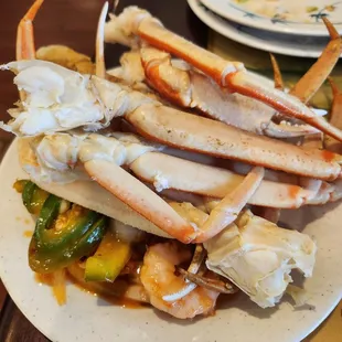 crab legs and vegetables on a plate