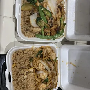 two take out containers of food