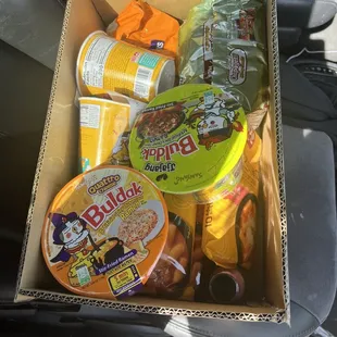 a box of food in the back seat of a car