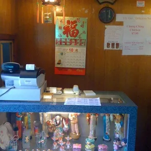 Cute little cash register area. Note the little gift shop case below, filled with purchasable items.