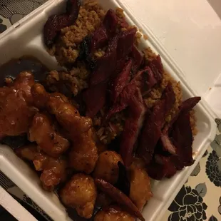 a tray of meat and rice