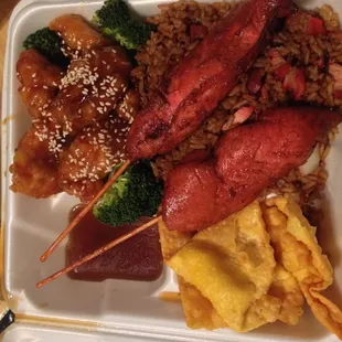 Combo #22 of sesame chicken, chicken on a stick, crab rangoons and pork fried rice.