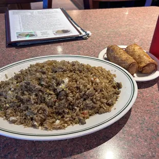 Beef friend rice and 2 eggrolls. Portions are TX size.