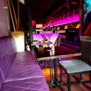 a purple couch in a bar