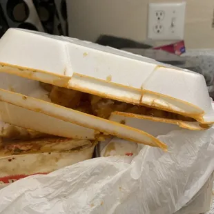 Orange tofu that melted through its container onto everything else