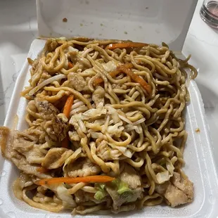 a take out box of noodles