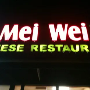 a neon sign for a chinese restaurant