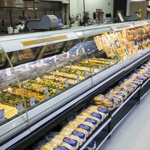 a deli case filled with different types of food