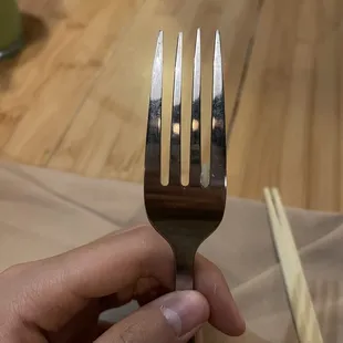 A tried rice on an unused fork