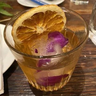 a drink with a slice of orange