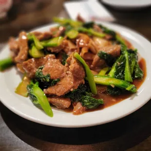 a plate of food with broccoli and meat